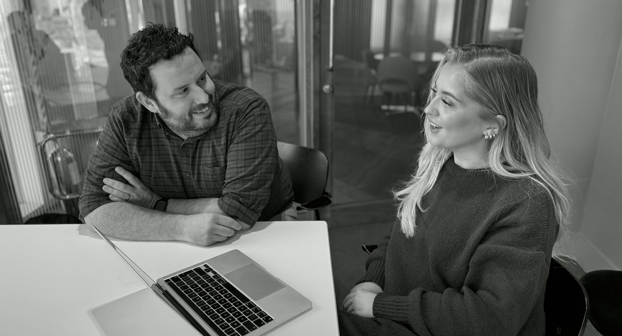 Made Agency team members discussing captivating creative, brilliant branding and distinctive digital services for professional services B2B brands